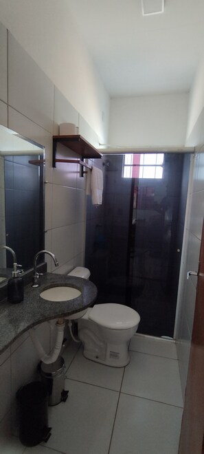 Shower, hair dryer, towels, toilet paper