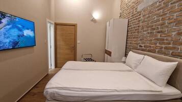 Suíte estúdio luxo, para não fumantes, banheiro privativo | Cofres nos quartos, escrivaninha, ferros/tábuas de passar roupa