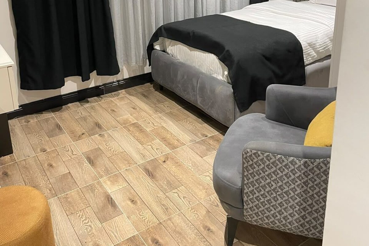 Economy eenpersoonskamer, uitzicht op stad | Luxe beddengoed, beddengoed