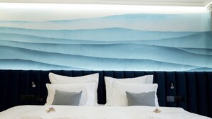 A bed with a dark headboard, white bedding, and decorative pillows. - Hotel Imperia Fratelli (Sliven)