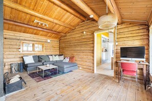 Hytte - 3 soveværelser - balkon - udsigt til have | Opholdsområde | Bøger