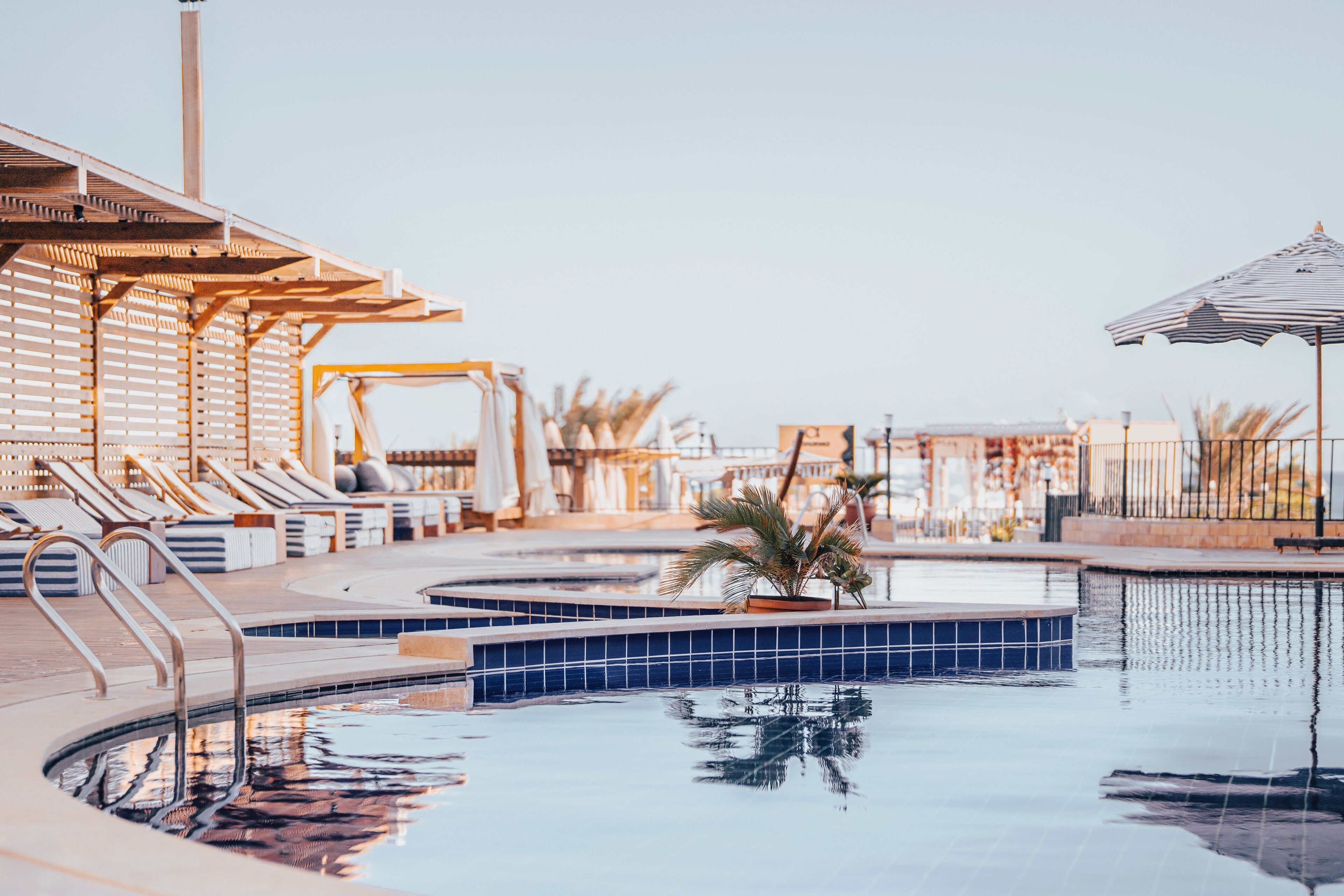 Outdoor pool, free pool cabanas, pool umbrellas