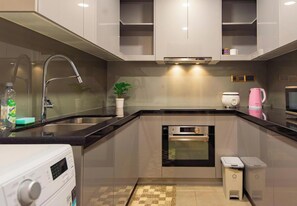 Fridge, stovetop, cleaning supplies, freezer - D1MENSION Iconic Central Luxury Living (Ho Chi Minh)