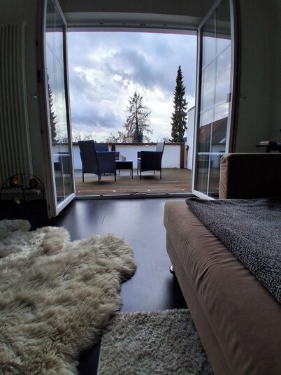 Exclusive loft with fireplace & sun terrace near the trade fair directly at the train station & parking lot