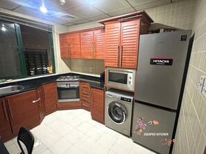 Economy Double Room, Balcony, City View | Shared kitchen | Fridge, microwave, stovetop - Center Point Partition Room in Tecom (Dubai)