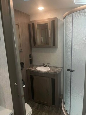 Shower, towels, soap, toilet paper