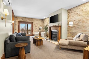 TV, fireplace, offices - Marina View | River Street Lofts | Lake Michigan (Elk Rapids)