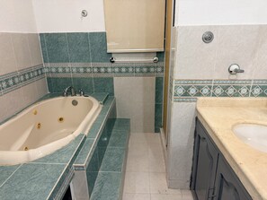 Shower, jetted tub, towels, soap