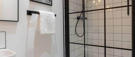 Shower, hair dryer, towels, soap