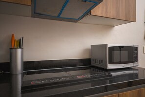 Fridge, microwave, stovetop, coffee/tea maker