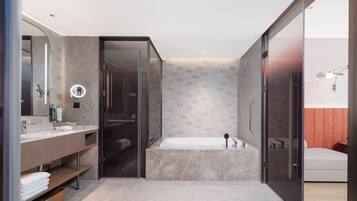 Deluxe Suite, 1 King Bed | Bathroom | Shower, rainfall showerhead, free toiletries, hair dryer