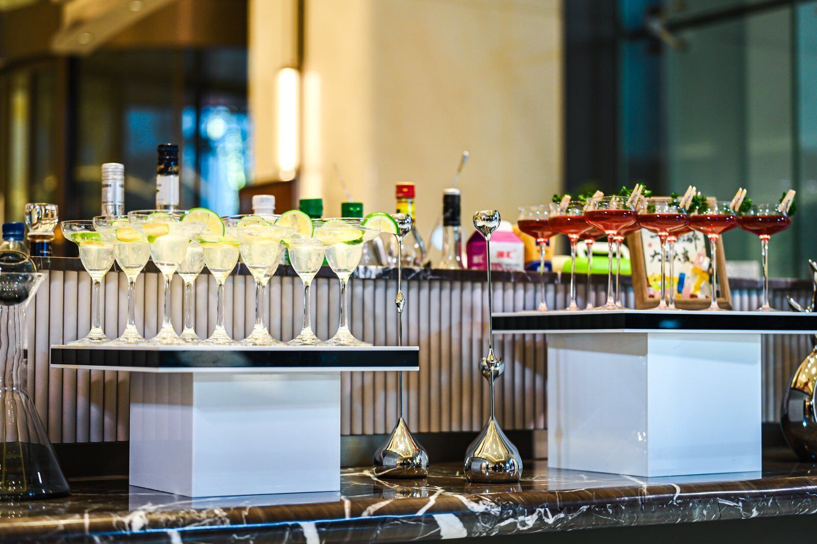 A bar area with a variety of drinks and bottles.