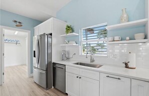 Fridge, dishwasher, coffee/tea maker, dining tables - Clear Day - Luxury on the Water (Fort Myers Beach)
