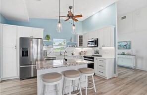 Fridge, dishwasher, coffee/tea maker, dining tables - Clear Day - Luxury on the Water (Fort Myers Beach)