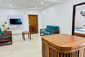 43-inch flat-screen TV with digital channels, Netflix - THS Suites (Tirupati)