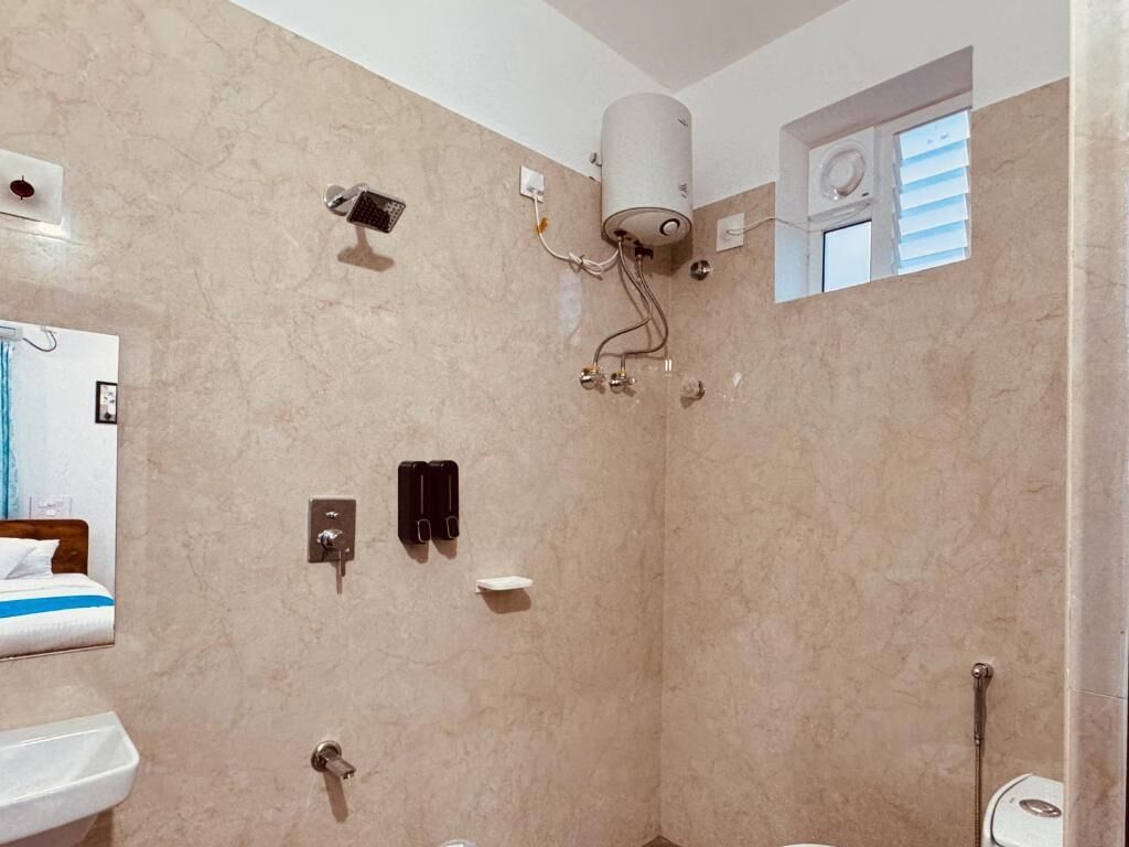 Shower, rainfall showerhead, hair dryer, towels