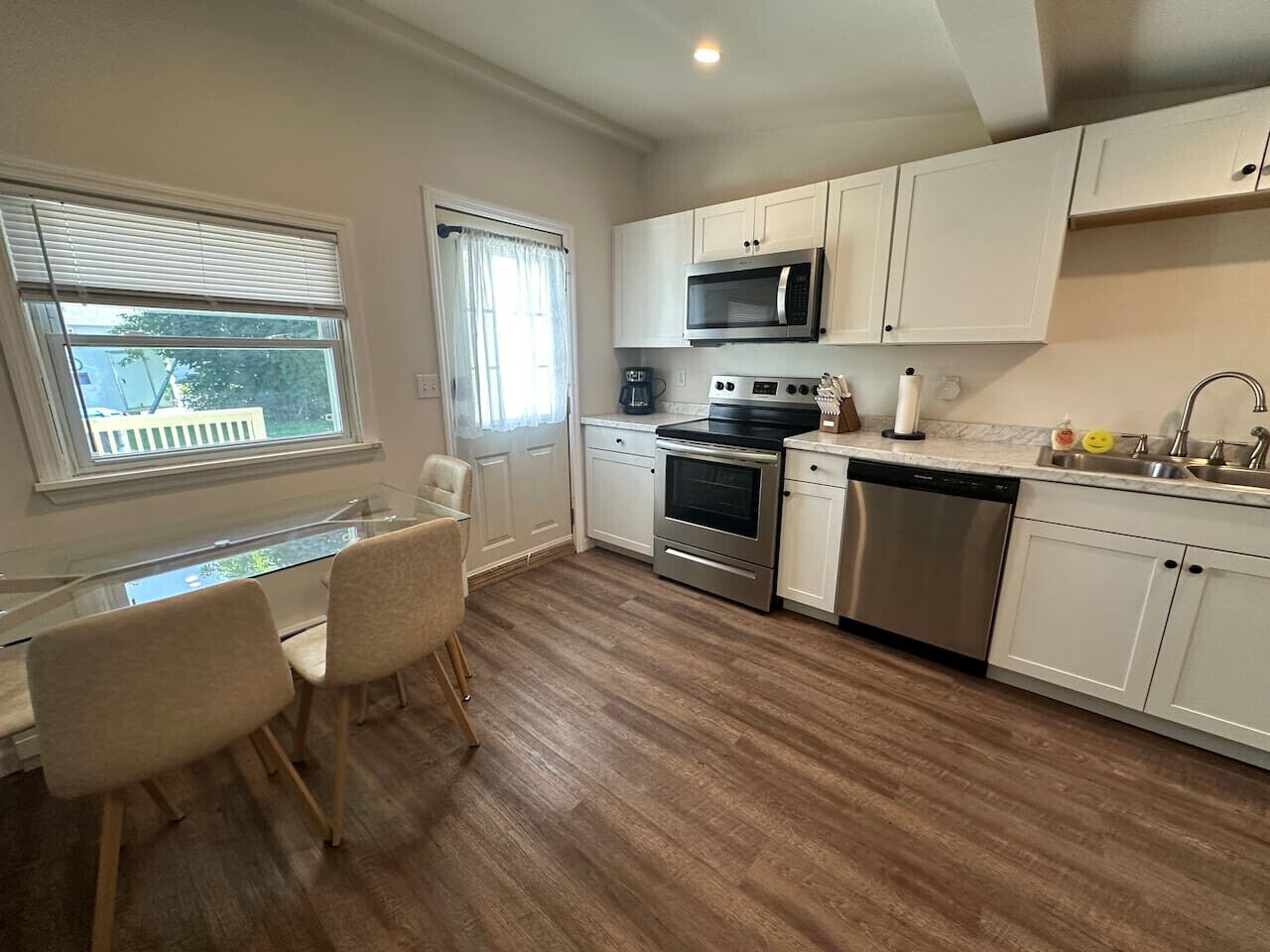 Fridge, dishwasher, coffee/tea maker, cookware/dishes/utensils