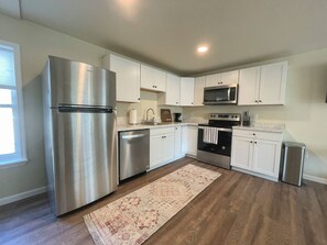 Fridge, coffee/tea maker, cookware/dishes/utensils