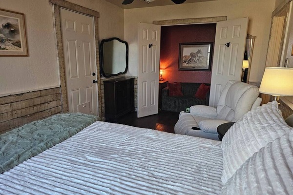 Spacious bedroom/living area with access to outdoor spaces