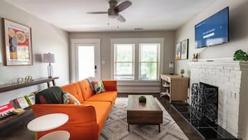 Smart TV, fireplace, books, offices