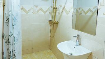 Shower, towels, soap, toilet paper