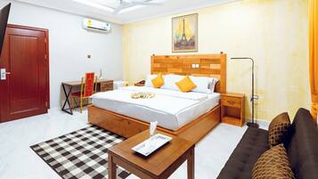 Deluxe Double Room, Courtyard View | Desk, laptop workspace, iron/ironing board, free WiFi