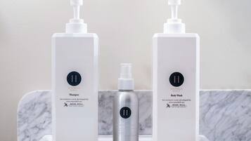 Shower, eco-friendly toiletries, hair dryer, towels