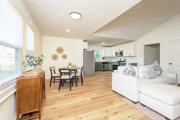 Living area - Queen’s Quarters! 6BR 3B Near Atrium Health & WFU (Winston-Salem)