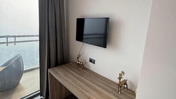 Suite estudio de lujo, vistas a la ciudad | Zona de estar