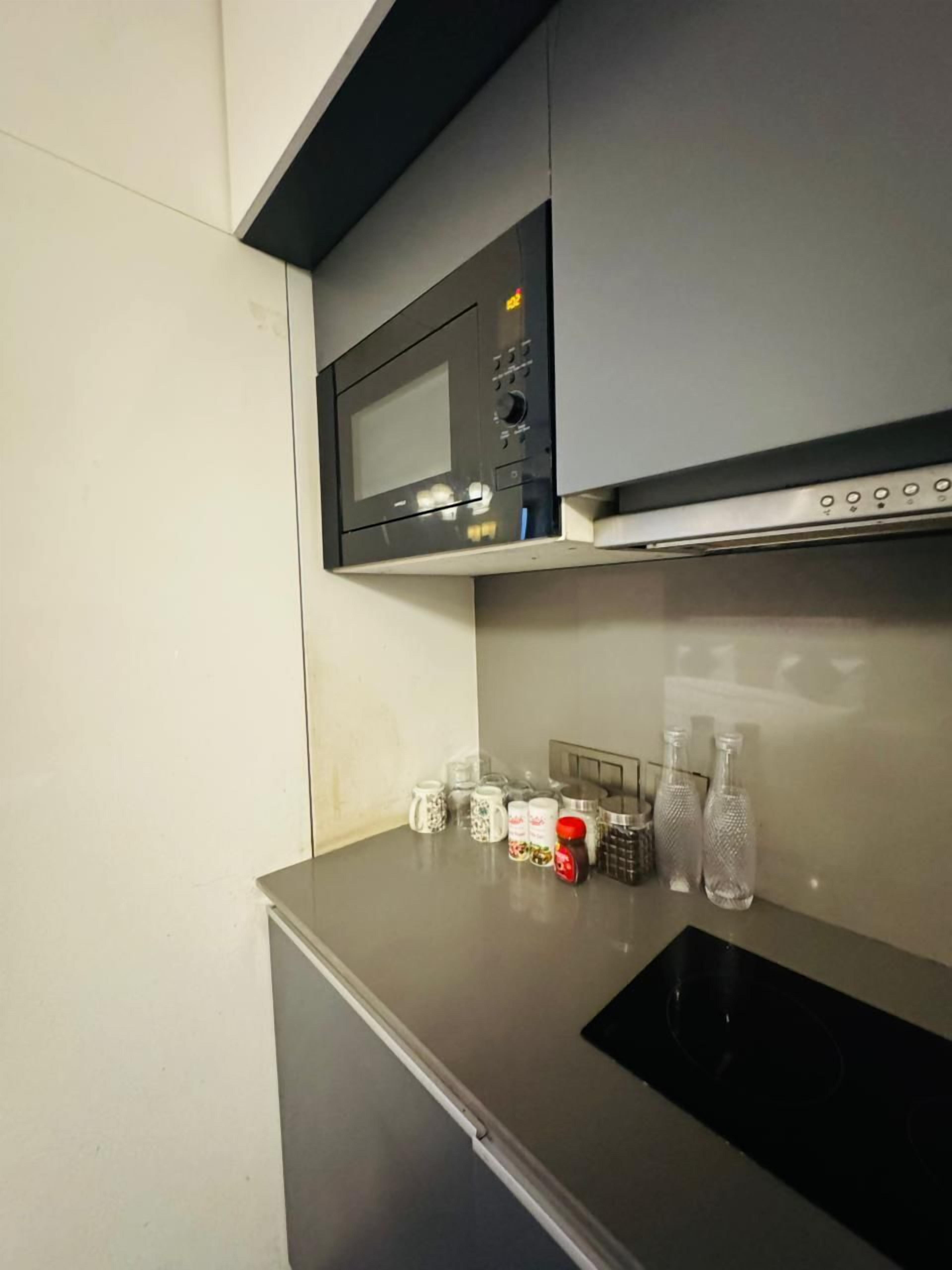 Mini-fridge, microwave, cookware/dishes/utensils