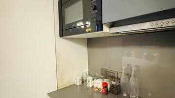 Mini-fridge, microwave, cookware/dishes/utensils