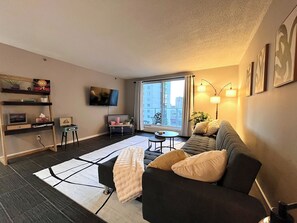 Smart TV, fireplace, books, stereo - The Lux Boutique Suite - Downtown Condo (Saskatoon)