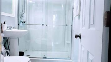 Shower, hair dryer, towels, soap