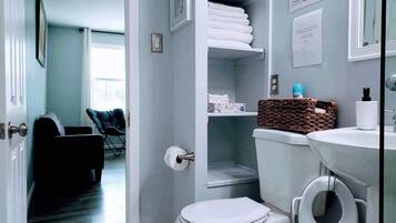 Shower, hair dryer, towels, soap