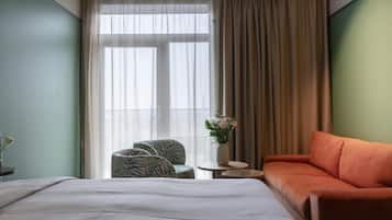 Deluxe Room, 1 King Bed, Balcony, Sea View | Premium bedding, in-room safe, desk, laptop workspace