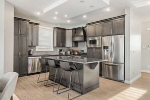 Coffee/tea maker, fridge, microwave, oven - The Dynasty | 3200 sqft | 2 Full Suites | Fire Pit (Airdrie)