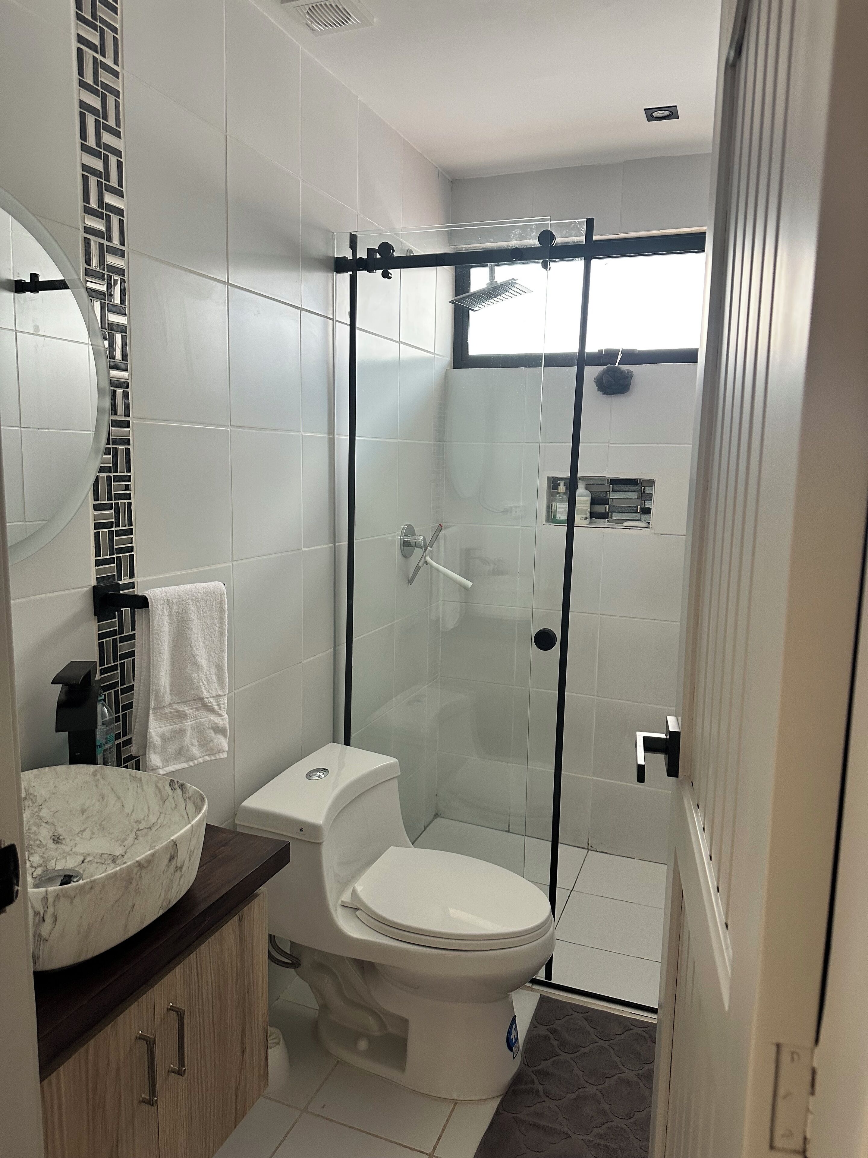 Shower, hair dryer, towels, soap