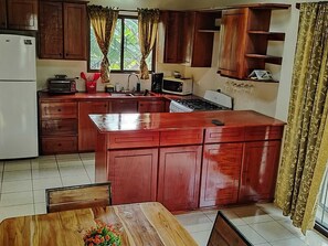 Private kitchen - Casa Mango Two-bedroom home a short 4-minutes walk from the ocean, w/ pool & BBQ (Guanacaste Province)