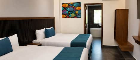 Habitación doble Deluxe | Edredón, espacio para trabajar con laptop, wifi gratis y ropa de cama