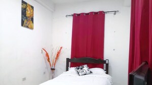 A bedroom with a bed, a red curtain, a white wall, and a painting. - Independent room (David)