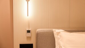 A hotel room with a bed, a thermostat, and a wall-mounted control panel. - Zins Luxury Room Vollga (Durrës)