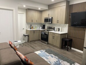 TV - Beautiful, Clean, and Cozy suite (Airdrie)