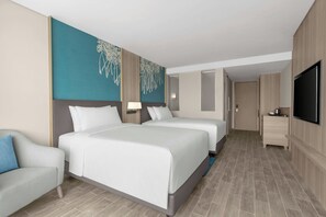 Luxe beddengoed, een minibar, een kluis op de kamer