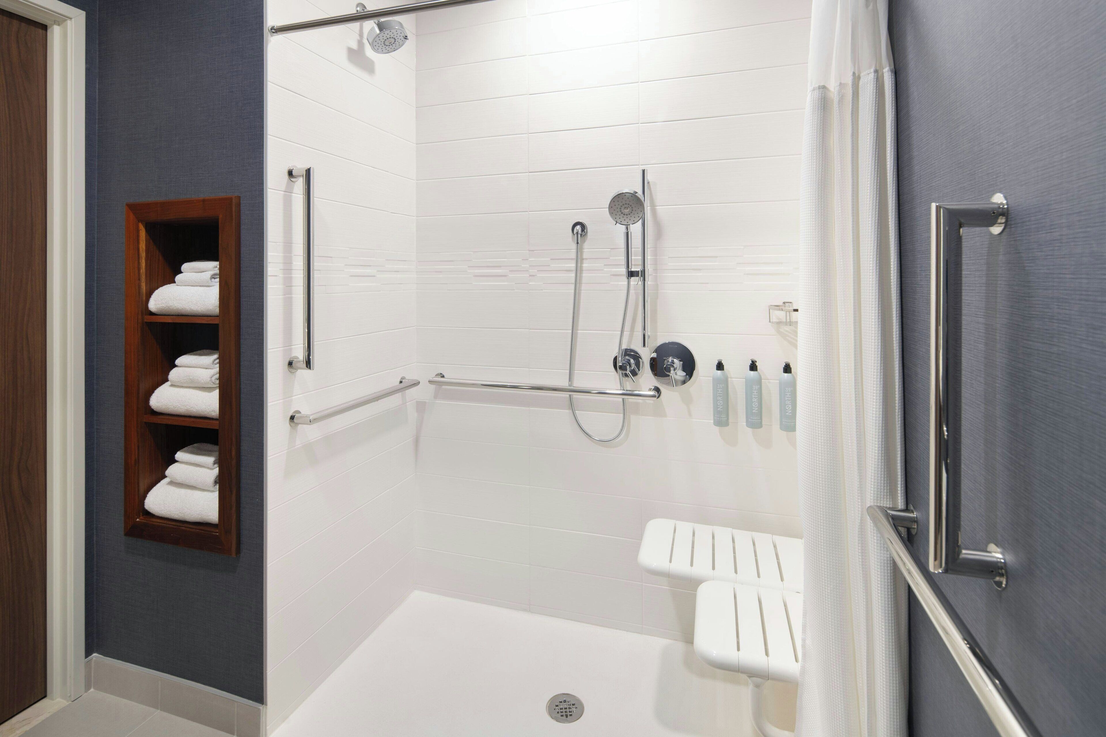 Studio, 1 King Bed (Mobil & Hearing Acc w/ Roll Shwr) | Bathroom | Free toiletries, hair dryer, towels, soap