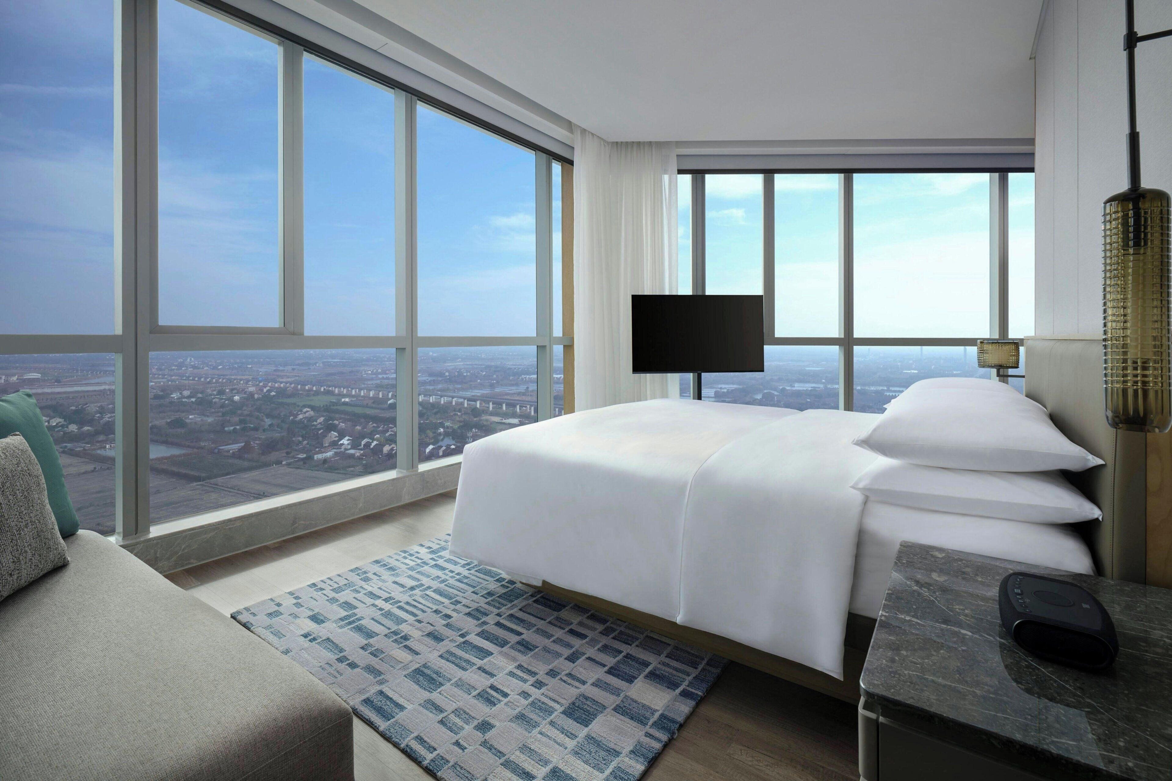 Deluxe Room, 1 King Bed | Down comforters, in-room safe, desk, blackout drapes
