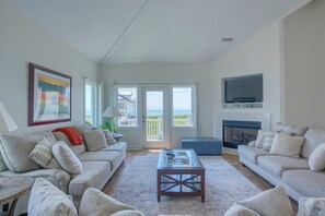 TV, fireplace - Dock Holiday: 8BR Soundfront Home w/ Hot Tub, Ocean Views & Dock (North Topsail Beach)