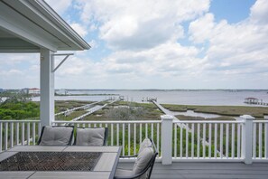 Outdoor dining - Dock Holiday: 8BR Soundfront Home w/ Hot Tub, Ocean Views & Dock (North Topsail Beach)
