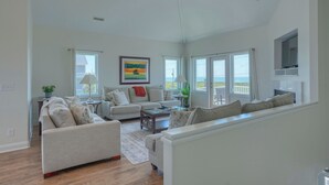 TV, fireplace - Dock Holiday: 8BR Soundfront Home w/ Hot Tub, Ocean Views & Dock (North Topsail Beach)