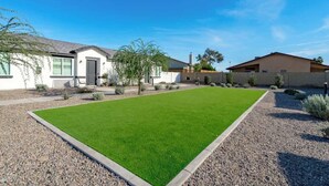 A residential property with a well-maintained lawn, a patio area, and a house with a modern design. - Glendale 1BR/1BA 3 Beds Pool, Gym & Parking (Glendale)