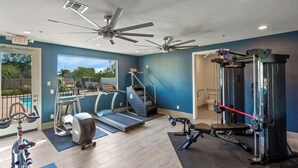 A home gym with exercise equipment, a treadmill, and a ceiling fan. - Glendale 1BR/1BA 3 Beds Pool, Gym & Parking (Glendale)